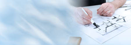 Architect working on plans of new house; panoramic bannerの写真素材