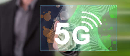 Man touching a 5g concept on a touch screen with his finger