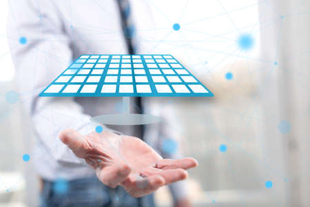 Clean energy concept above the hand of a man in background