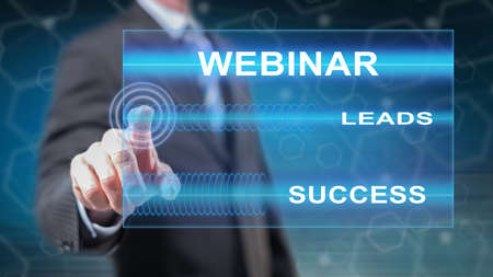 Man touching a webinar concept on a touch screen with his fingers