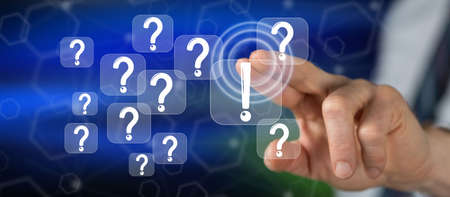 Man touching a q & a concept on a touch screen with his finger