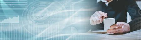 Male hand using mobile phone; panoramic banner