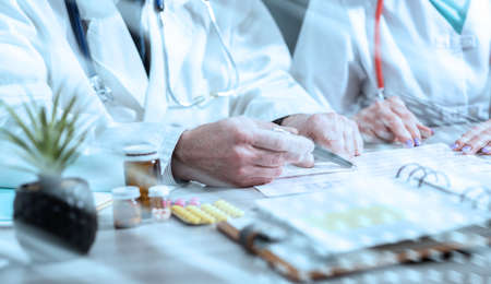 Two doctors discussing about medical results in clinic; light effectの写真素材