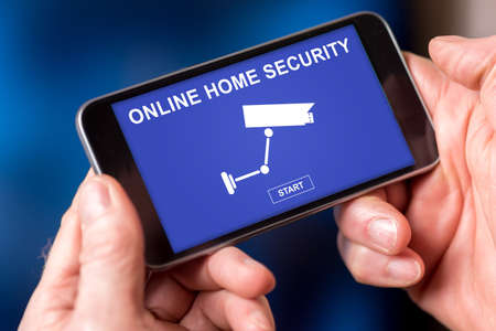 Smartphone screen displaying an online home security conceptの写真素材