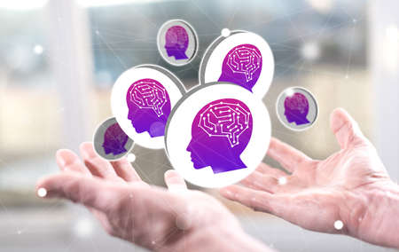 Artificial intelligence concept above the hands of a man