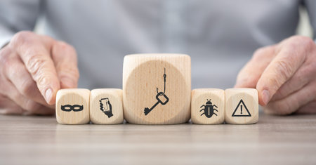 Wooden blocks with symbol of phishing conceptの写真素材