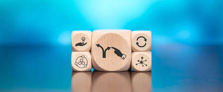 Wooden blocks with symbol of coaching concept on blue backgroundの写真素材