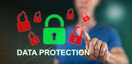 Man touching a data protection concept on a touch screen with his finger