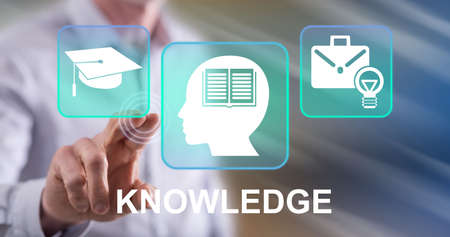 Man touching a knowledge concept on a touch screen with his fingerの写真素材