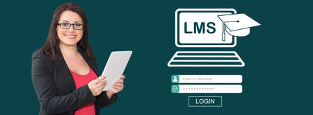 Woman using digital tablet with lms concept on backgroundの写真素材