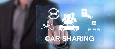 Man touching a car sharing concept on a touch screen with his fingerの写真素材