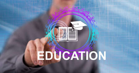 Man touching an education concept on a touch screen with his finger