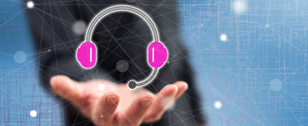 Call center concept above the hand of a man in background