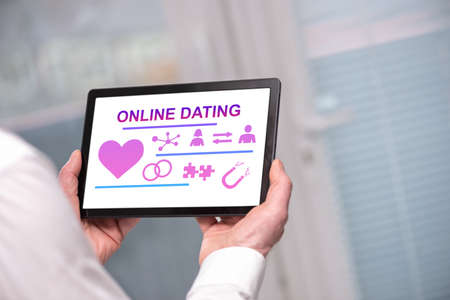 Online dating concept shown on a tablet held by a man