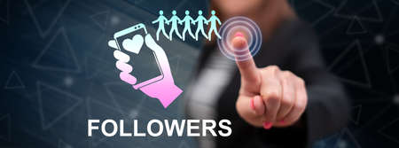 Woman touching a followers concept on a touch screen with her fingerの写真素材