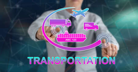 Man touching a transportation concept on a touch screen with his fingers