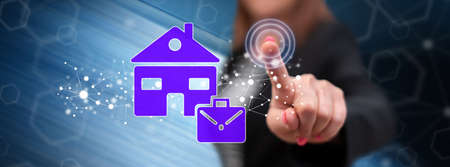 Woman touching a work from home concept on a touch screen with her finger