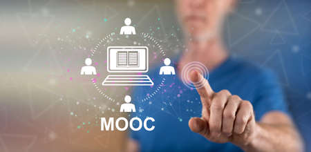 Man touching a mooc concept on a touch screen with his fingerの写真素材