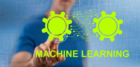 Man touching a machine learning concept on a touch screen with his fingerの写真素材