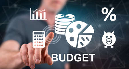 Man touching a budget concept on a touch screen with his finger