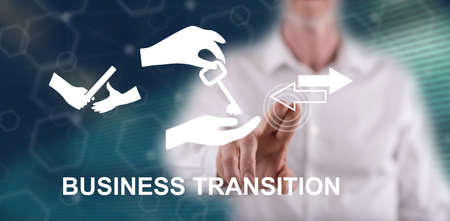 Man touching a business transition concept on a touch screen with his fingerの写真素材