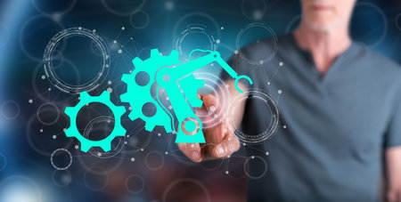 Man touching a robotic industry concept on a touch screen with his fingerの写真素材