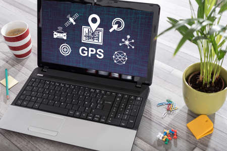 Laptop on a desk with gps concept on the screenの写真素材