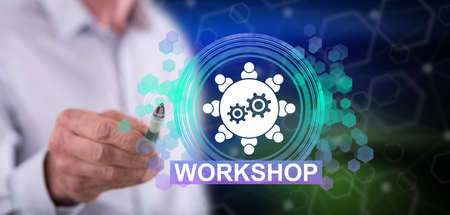 Man touching a workshop concept on a touch screen with a penの写真素材