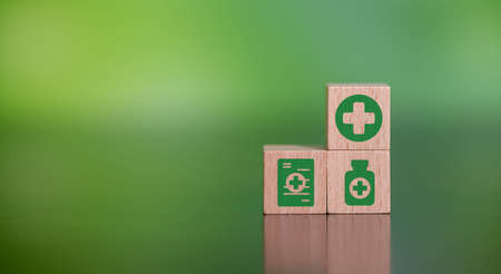 Concept of natural medicine with icons on wooden cubes