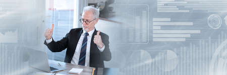 Senior businessman with thumbs up; business success; panoramic banner