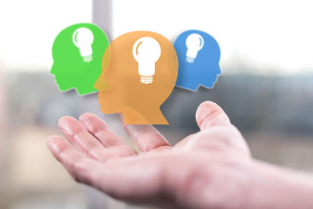 Human brain ideas concept above a hand of a man