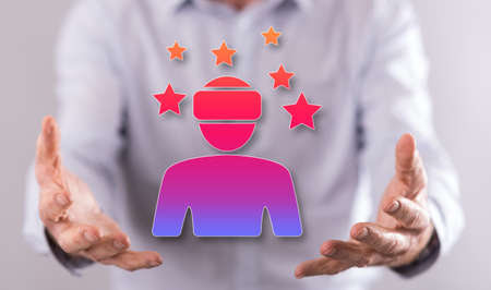 Virtual reality concept above the hands of a man in backgroundの写真素材