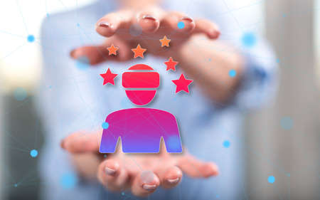 Virtual reality concept between hands of a woman in backgroundの写真素材