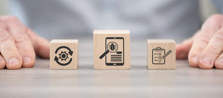 Wooden blocks with symbol of software testing concept