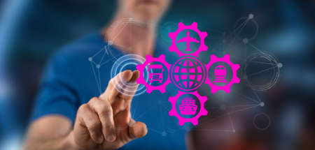 Man touching a global transportation concept on a touch screen with his finger
