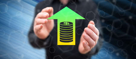 Profit concept between hands of a man in background