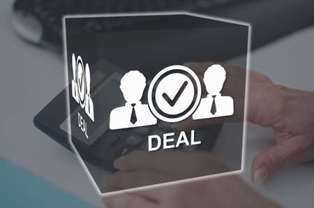 Deal concept illustrated by a picture on backgroundの写真素材