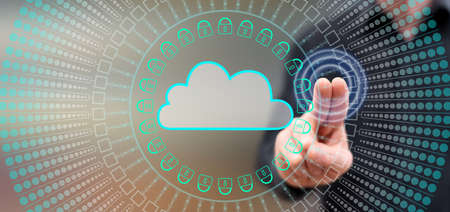 Man touching a cloud networking concept on a touch screen with his fingers