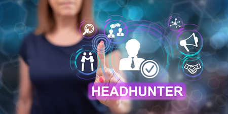 Woman touching a recruitment concept on a touch screen with her fingerの写真素材