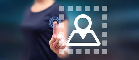 Woman touching a navigation system concept on a touch screen with her fingerの写真素材