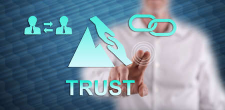 Man touching a trust concept on a touch screen with his finger