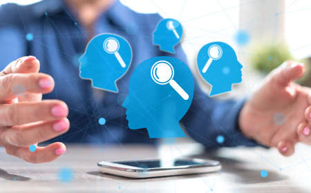 Smartphone with analyzing concept between hands of a woman in background