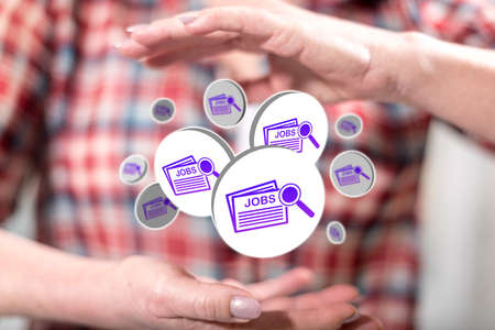 Job search concept between hands of a woman in backgroundの写真素材