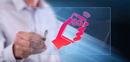 Man touching a 5g concept on a touch screen with a penの写真素材