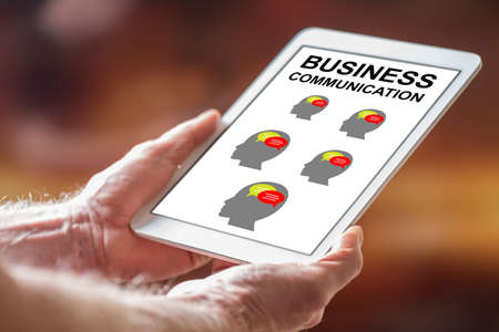 Man holding a tablet showing business communication conceptの写真素材