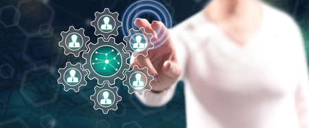 Woman touching a social network concept on a touch screen with her fingers