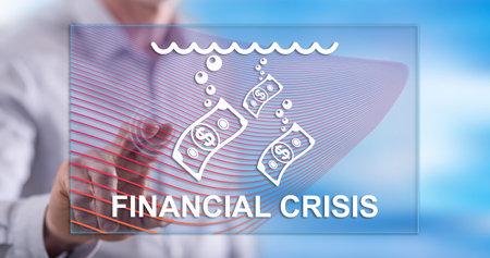 Man touching a financial crisis concept on a touch screen with his fingerの写真素材