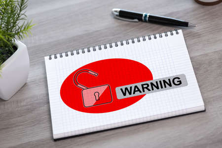 Warning concept drawn on a notepad