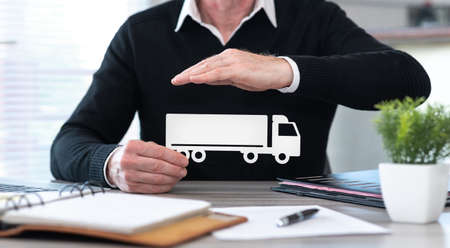 Insurer protecting a truck with his hand