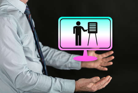 Online school concept above the hands of a manの写真素材